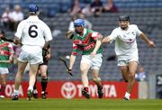 24 July 2004; Stephen Coyne, Mayo, is tackled by Kildare's John Brennan and David Harvey, 6. All-Ireland Senior B Hurling Final, Kildare v Mayo, Croke Park, Dublin. Picture credit; Ray McManus / SPORTSFILE