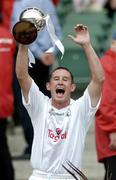 24 July 2004; Kildare captain Adrian McAndrew lifts the cup after victory over Mayo. All-Ireland Senior B Hurling Final, Kildare v Mayo, Croke Park, Dublin. Picture credit; Brendan Moran / SPORTSFILE