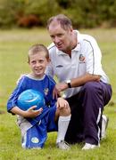 27 July 2004; Republic of Ireland manager Brian Kerr with Padraig Wafer, from Wexford. Padraig won a prize of a lifetime, the chance to travel to Madrid to participate in a specially organised training session with Real Madrid stars David Beckham, Roberto Carlos and Raul, while he attended the FAI Pepsi Summer Soccer School in Palmerstown Rangers Club, Dublin. Picture credit; Damien Eagers / SPORTSFILE