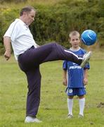 27 July 2004; Republic of Ireland manager Brian Kerr with Padraig Wafer, from Wexford, who won a prize of a lifetime, the chance to travel to Madrid to participate in a specially organised training session with Real Madrid stars David Beckham, Roberto Carlos and Raul, while he attended the FAI Pepsi Summer Soccer School in Palmerstown Rangers Club, Dublin. Picture credit; Damien Eagers / SPORTSFILE