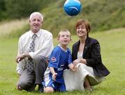 27 July 2004; Padraig Wafer, from Wexford, with his parents Pat and Jean. Padraig won a prize of a lifetime, the chance to travel to Madrid to participate in a specially organised training session with Real Madrid stars David Beckham, Roberto Carlos and Raul, while he attended the FAI Pepsi Summer Soccer School in Palmerstown Rangers Club, Dublin. Picture credit; Damien Eagers / SPORTSFILE