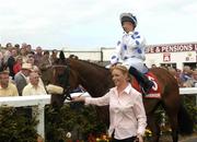 27 July 2004; Jockey Rory Cleary shows his emotions while Palace Star is led into the winners enclosure by Jodi Farrelly after winning the McDonagh EBF Handicap. Galway Races, Ballybrit, Co. Galway. Picture credit; Pat Murphy / SPORTSFILE