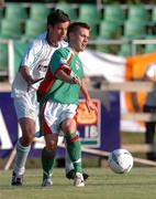 28 July 2004; Liam Kearney, Cork City, in action against Alan Mahon, UCD. FAI Cup Replay, UCD v Cork City, Belfield Park, UCD, Dublin. Picture credit; Brian Lawless / SPORTSFILE