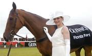 29 July 2004; Model Polly Robinson with Florida Pearl. As Sponsors of Galway Hurdle Day Guinness added something special to the Galway Races earlier today by parading one of Ireland's greatest horses Florida Pearl before the start of the days races. Galway Races, Ballybrit, Co. Galway. Picture credit; Pat Murphy / SPORTSFILE