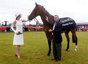 29 July 2004; Model Polly Robinson and ex-jockey Adrian Maguire, who steered Florida Pearl home to victory in the King George VI Chase in 2001, with Florida Pearl. As sponsors of Galway Hurdle Day Guinness added something special to the Galway races earlier today by parading one of Ireland's greatest horses, Florida Pearl, before the start of the days races. Galway Races, Ballybrit, Co. Galway. Picture credit; Damien Eagers / SPORTSFILE