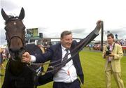 29 July 2004; Winning owner Bernard Gillane celebrates with his horse Cloone River after he had won the Guinness Galway Hurdle Handicap. Galway Races, Ballybrit, Co. Galway. Picture credit; Damien Eagers / SPORTSFILE