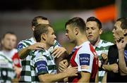 13 September 2013; Pat Sullivan, Shamrock Rovers, left, and Greg Bolger, St Patrick’s Athletic, confront each other after the St Patrick’s Athletic player had been sent off by referee Alan Kelly. FAI Ford Cup Quarter-Final, St Patrick’s Athletic v Shamrock Rovers, Richmond Park, Dublin. Picture credit: David Maher / SPORTSFILE