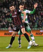 29 March 2024; Jordan Flores of Bohemians in action against Graham Burke of Shamrock Rovers during the SSE Airtricity Men's Premier Division match between Shamrock Rovers and Bohemians at Tallaght Stadium in Dublin. Photo by David Fitzgerald/Sportsfile