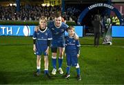 29 March 2024; Leinster captain Luke McGrath with match day mascots Liam Alejandro Shirley and Ciarán Kirrane before the United Rugby Championship match between Leinster and Vodacom Bulls at the RDS Arena in Dublin. Photo by Harry Murphy/Sportsfile