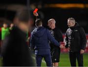 29 March 2024; Referee Marc Lynch shows a red card to Sligo Rovers physiotherpist James O'Donnell, not pictured, during the SSE Airtricity Men's Premier Division match between Waterford and Sligo Rovers at the Regional Sports Centre in Waterford. Photo by Michael P Ryan/Sportsfile