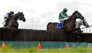 30 March 2024; Ardera Ru, right, with Shane O'Callaghan up, jump the last on their way to winning the BoyleSports Mares Handicap Steeplechase, from eventual second place, Instit, left, with Paul Townend up, on day one of the Fairyhouse Easter Festival at Fairyhouse Racecourse in Ratoath, Meath. Photo by Seb Daly/Sportsfile