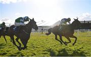 30 March 2024; So Des Flos, left, with Charlotte Butler up, on their way to winning the Fred Kenny Memorial Ladies National Handicap Steeplechase, from eventual second place Klarc Kent, right, with Jody Townend up, on day one of the Fairyhouse Easter Festival at Fairyhouse Racecourse in Ratoath, Meath. Photo by Seb Daly/Sportsfile
