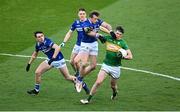 30 March 2024; Pearce Dolan of Leitrim in action against Kieran Lillis of Laois during the Allianz Football League Division 4 final match between Laois and Leitrim at Croke Park in Dublin. Photo by Ramsey Cardy/Sportsfile
