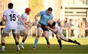30 March 2024; Bobby Sheehan of UCD is tackled by Diarmuid McCormack, right, and James Dillon of Dublin University  during the annual Men’s Rugby Colours match between Dublin University and UCD at College Park in Trinity College, Dublin. Photo by Sam Barnes/Sportsfile