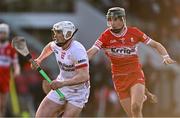 30 March 2024; Lorcan Devlin of Tyrone in action against Aimon Duffin of Derry during the Allianz Hurling League Division 2B final match between Derry and Tyrone at the Derry GAA Centre of Excellence in Owenbeg, Derry. Photo by Ben McShane/Sportsfile