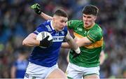 30 March 2024; Evan O'Carroll of Laois in action against Jack Foley of Leitrim during the Allianz Football League Division 4 final match between Laois and Leitrim at Croke Park in Dublin. Photo by Ramsey Cardy/Sportsfile