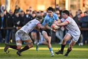 30 March 2024; James Tarrant of UCD in action against John Vinson,  left, and Aaron Coleman of Dublin University during the annual Men’s Rugby Colours match between Dublin University and UCD at College Park in Trinity College, Dublin. Photo by Sam Barnes/Sportsfile