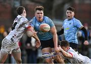 30 March 2024; Diarmuid Mangan of UCD in action against David Colbert,  left, and Aidan Henry of Dublin University during the annual Men’s Rugby Colours match between Dublin University and UCD at College Park in Trinity College, Dublin. Photo by Sam Barnes/Sportsfile