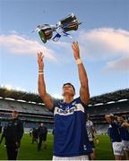 30 March 2024; Kevin Swayne of Laois celebrates with the trophy after the Allianz Football League Division 4 final match between Laois and Leitrim at Croke Park in Dublin. Photo by Ramsey Cardy/Sportsfile