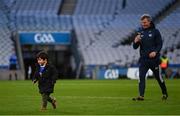 30 March 2024; Laois manager Justin McNulty, videos his son Setanta, age 3, after the Allianz Football League Division 4 final match between Laois and Leitrim at Croke Park in Dublin. Photo by Ramsey Cardy/Sportsfile
