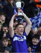 30 March 2024; Laois captain Evan O'Carroll lifts the cup after his side's victory in the Allianz Football League Division 4 final match between Laois and Leitrim at Croke Park in Dublin. Photo by Shauna Clinton/Sportsfile