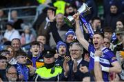 30 March 2024; Laois captain Evan O'Carroll lifts the cup after his side's victory in the Allianz Football League Division 4 final match between Laois and Leitrim at Croke Park in Dublin. Photo by Shauna Clinton/Sportsfile