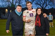 30 March 2024; John Vinson of Dublin University is presented with the player of the match award by UCD Rugby President David Coen, left, and Dublin University Football Club President Moira Flahive after the annual Men’s Rugby Colours match between Dublin University and UCD at College Park in Trinity College, Dublin. Photo by Sam Barnes/Sportsfile