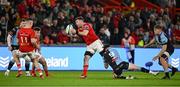 30 March 2024; Peter O’Mahony of Munster is tackled by Ellis Bevan of Cardiff during the United Rugby Championship match between Munster and Cardiff at Thomond Park in Limerick. Photo by Brendan Moran/Sportsfile