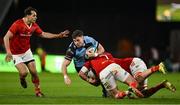 30 March 2024; Mason Grady of Cardiff is tackled by John Hodnett and Tadhg Beirne of Munster during the United Rugby Championship match between Munster and Cardiff at Thomond Park in Limerick. Photo by Brendan Moran/Sportsfile