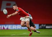 30 March 2024; Shane Daly of Munster is tackled by Owen Lane of Cardiff during the United Rugby Championship match between Munster and Cardiff at Thomond Park in Limerick. Photo by Harry Murphy/Sportsfile