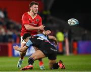 30 March 2024; Alex Nankivell of Munster is tackled by Ben Thomas of Cardiff  during the United Rugby Championship match between Munster and Cardiff at Thomond Park in Limerick. Photo by Harry Murphy/Sportsfile