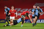 30 March 2024; Alex Nankivell of Munster is tackled by Cam Winnett of Cardiff during the United Rugby Championship match between Munster and Cardiff at Thomond Park in Limerick. Photo by Harry Murphy/Sportsfile