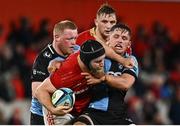 30 March 2024; Jeremy Loughman of Munster is tackled by Alex Mann of Cardiff during the United Rugby Championship match between Munster and Cardiff at Thomond Park in Limerick. Photo by Harry Murphy/Sportsfile