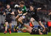 30 March 2024; John Heslin of Westmeath is tackled by Rory Mason of Down during the Allianz Football League Division 3 final match between Down and Westmeath at Croke Park in Dublin. Photo by Shauna Clinton/Sportsfile