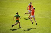 31 March 2024; Paddy Burns of Armagh in action against Luke McGlynn of Donegal during the Allianz Football League Division 2 Final match between Armagh and Donegal at Croke Park in Dublin. Photo by Ramsey Cardy/Sportsfile