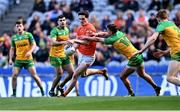 31 March 2024; Jarly Óg Burns of Armagh is tackled by Peadar Mogan of Donegal during the Allianz Football League Division 2 Final match between Armagh and Donegal at Croke Park in Dublin. Photo by Piaras Ó Mídheach/Sportsfile