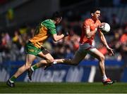 31 March 2024; Rory Grugan of Armagh in action against Kevin McGettigan of Donegal during the Allianz Football League Division 2 Final match between Armagh and Donegal at Croke Park in Dublin. Photo by Piaras Ó Mídheach/Sportsfile