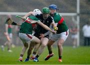 31 March 2024; Rory McHugh of Sligo in action against John Heraty, left, and Eoghan Collins of Mayo during the Allianz Hurling League Division 3A Final match between Mayo and Sligo at Hastings Insurance MacHale Park in Castlebar, Mayo. Photo by Tyler Miller/Sportsfile
