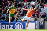 31 March 2024; Stefan Campbell of Armagh in action against Caolan McGonagle of Donegal during the Allianz Football League Division 2 Final match between Armagh and Donegal at Croke Park in Dublin. Photo by Ramsey Cardy/Sportsfile