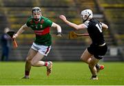 31 March 2024; Oisin Greally of Mayo in action against Gerard O'Kelly Lynch of Sligo during the Allianz Hurling League Division 3A Final match between Mayo and Sligo at Hastings Insurance MacHale Park in Castlebar, Mayo. Photo by Tyler Miller/Sportsfile