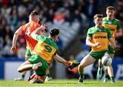 31 March 2024; Peter McGrane of Armagh shoots under pressure from Michael Langan of Donegal during the Allianz Football League Division 2 Final match between Armagh and Donegal at Croke Park in Dublin. Photo by Ramsey Cardy/Sportsfile