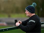 31 March 2024; Fermanagh manager Joe Baldwin takes notes during the Allianz Hurling League Division 3B Final match between Fermanagh and Warwickshire at St Joseph's Park in Ederney, Fermanagh. Photo by Sam Barnes/Sportsfile