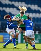 31 March 2024; Sam Monaghan of Ireland is tackled by Beatrice Veronese and Valeria Fedrighi of Italy during the Women's Six Nations Rugby Championship match between Ireland and Italy at the RDS Arena in Dublin. Photo by Harry Murphy/Sportsfile