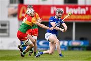 31 March 2024; Aaron Dunphy of Laois in action against James Doyle of Carlow during the Allianz Hurling League Division 2A Final match between Carlow and Laois at Netwatch Cullen Park in Carlow. Photo by Ben McShane/Sportsfile
