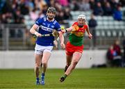 31 March 2024; Aaron Dunphy of Laois in action against Fiachra Fitzpatrick of Carlow during the Allianz Hurling League Division 2A Final match between Carlow and Laois at Netwatch Cullen Park in Carlow. Photo by Ben McShane/Sportsfile
