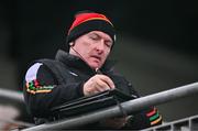 31 March 2024; Suspended Carlow manager Tom Mullally takes notes from the stands during the Allianz Hurling League Division 2A Final match between Carlow and Laois at Netwatch Cullen Park in Carlow. Photo by Ben McShane/Sportsfile