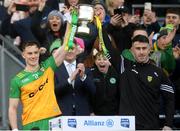 31 March 2024; Donegal joint-captains Ciarán Thompson, left, and Patrick McBrearty lift the cup after their side's victory in the Allianz Football League Division 2 Final match between Armagh and Donegal at Croke Park in Dublin. Photo by John Sheridan/Sportsfile