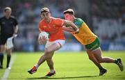 31 March 2024; Rory Grugan of Armagh in action against Peadar Mogan of Donegal during the Allianz Football League Division 2 Final match between Armagh and Donegal at Croke Park in Dublin. Photo by Ramsey Cardy/Sportsfile