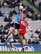 31 March 2024; Brian Fenton of Dublin in action against Ethan Doherty of Derry during the Allianz Football League Division 1 Final match between Dublin and Derry at Croke Park in Dublin. Photo by Ramsey Cardy/Sportsfile