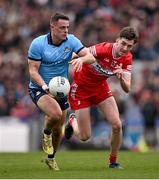 31 March 2024; Cian Murphy of Dublin in action against Paul Cassidy of Derry during the Allianz Football League Division 1 Final match between Dublin and Derry at Croke Park in Dublin. Photo by Ramsey Cardy/Sportsfile